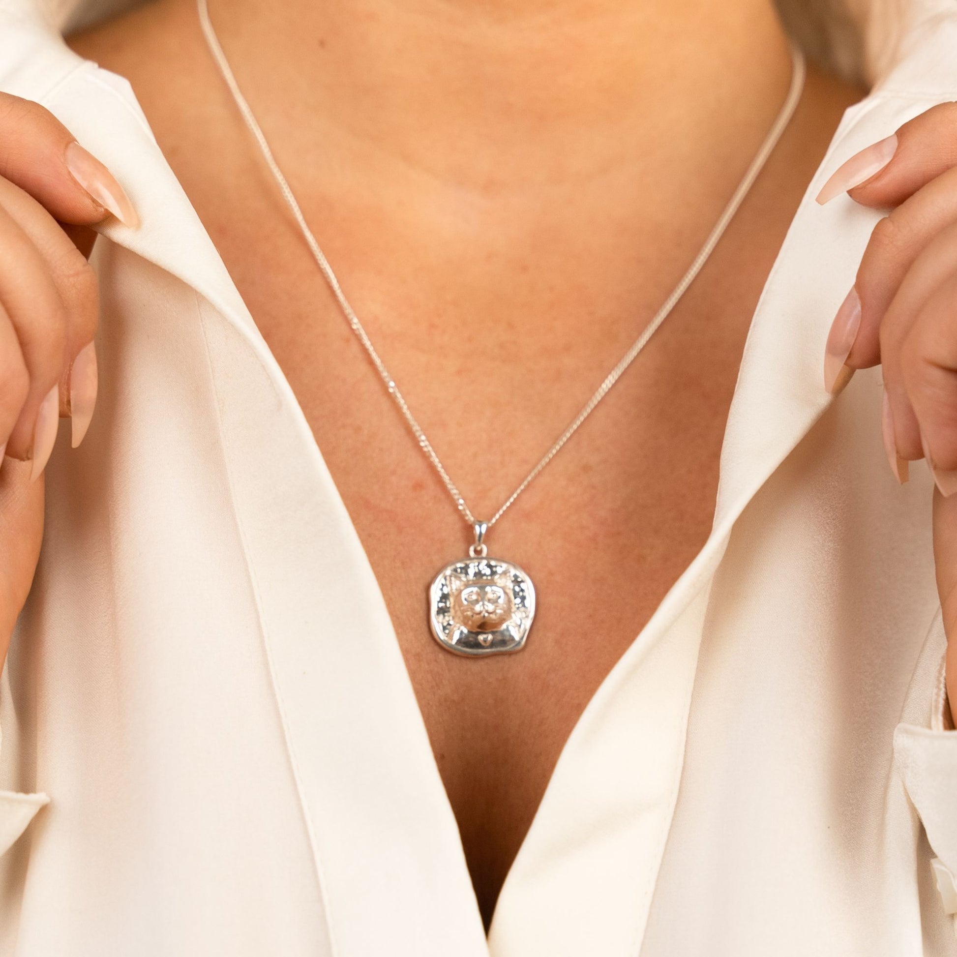 female model wearing the lars cat coin necklace in sterling silver