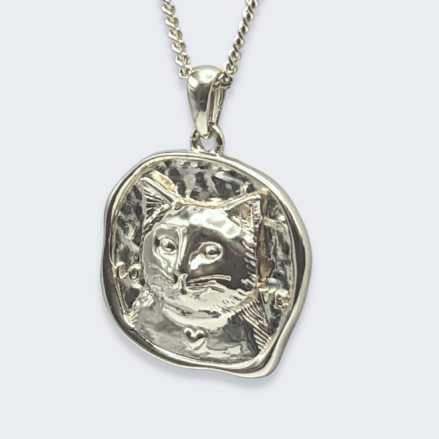 lars cat coin necklace in sterling silver (left side view)