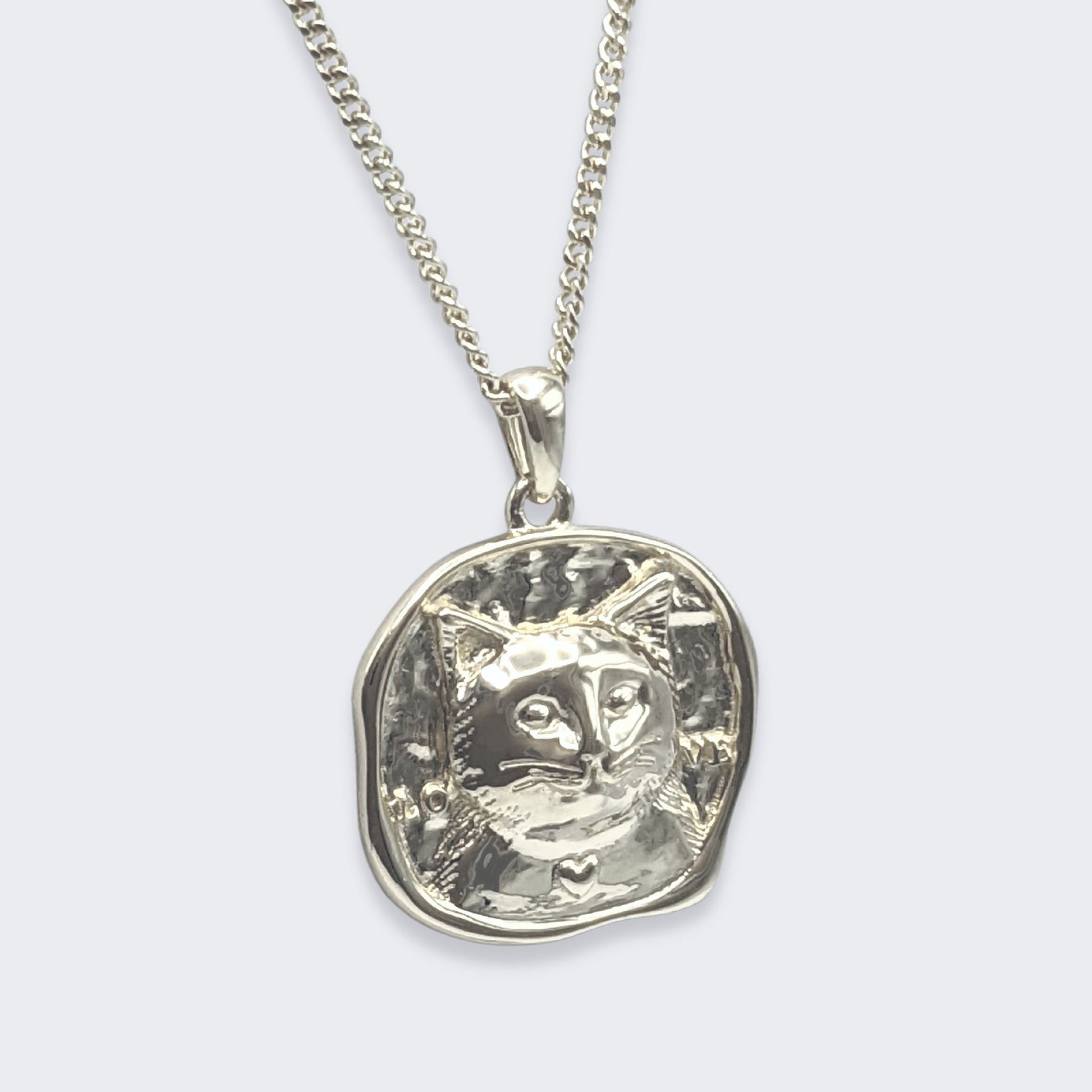 lars cat coin necklace in sterling silver (right side view)
