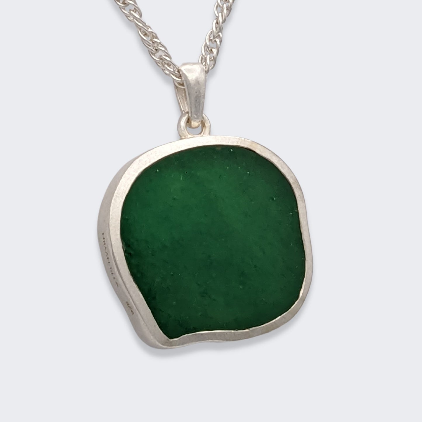 lars reversible cat coin necklace in sterling silver reversed (back view), green aventurine