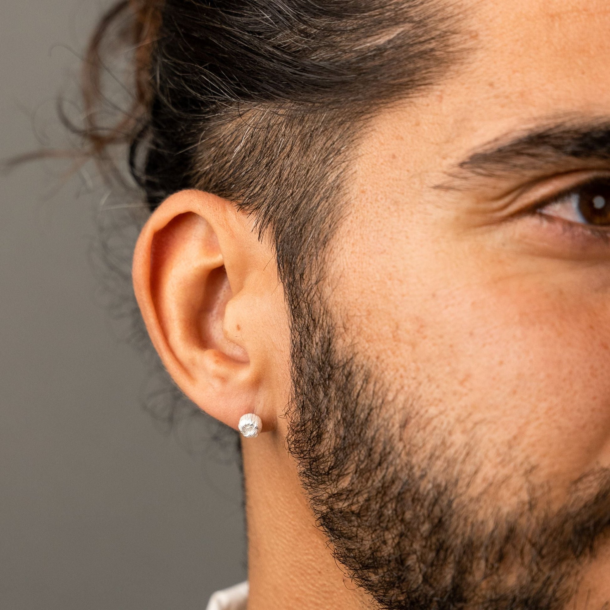 male model wearing the ren yarn stud earring in sterling silver