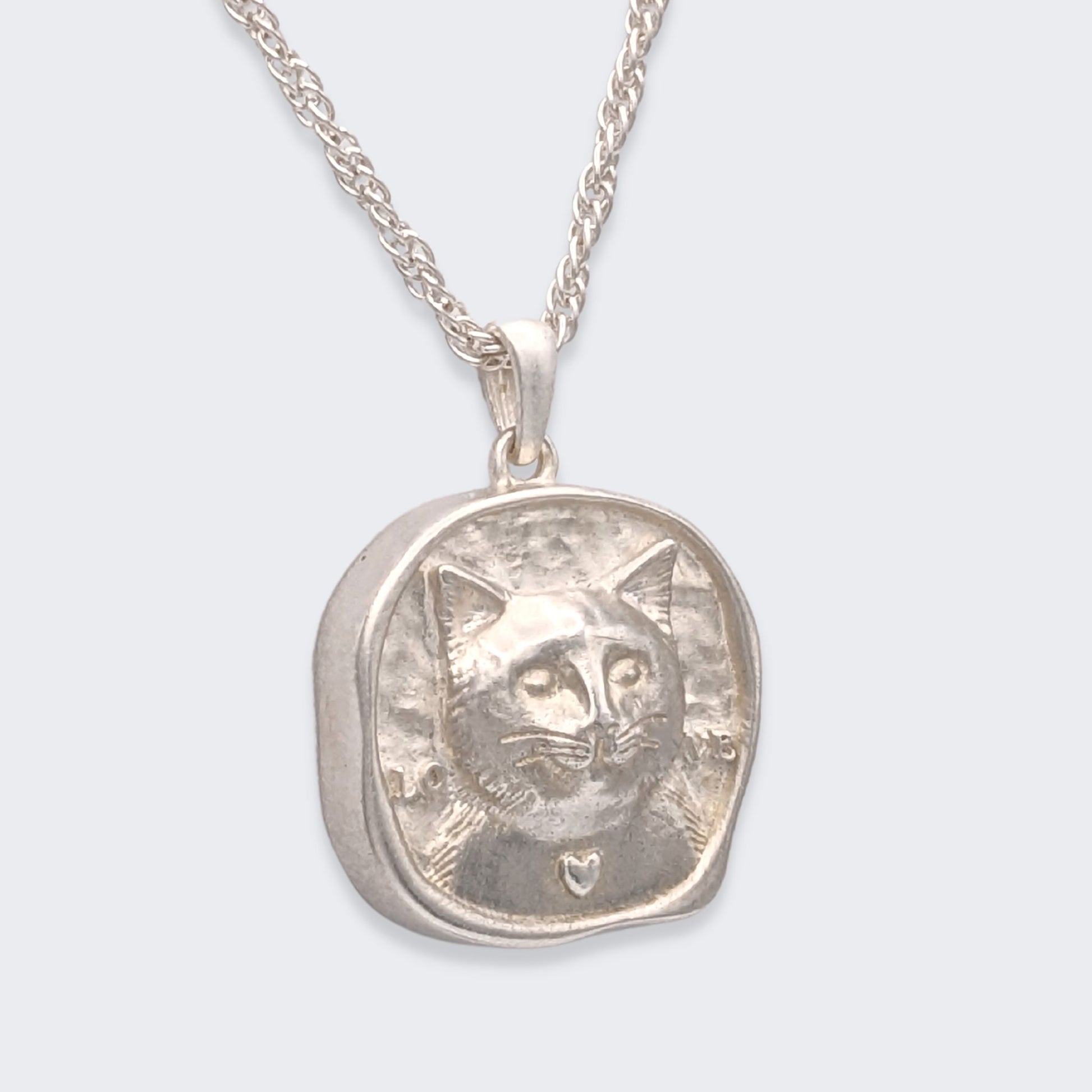 lars reversible cat coin necklace in sterling silver (right side view)