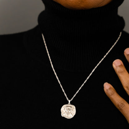 female model wearing the lars reversible dog coin necklace in sterling silver