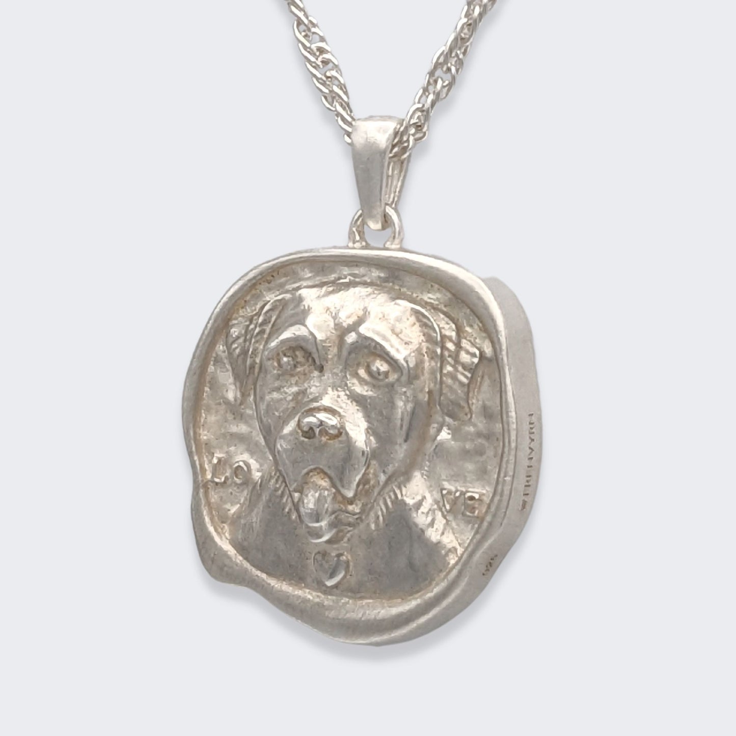 lars reversible dog coin necklace in sterling silver (left side view)