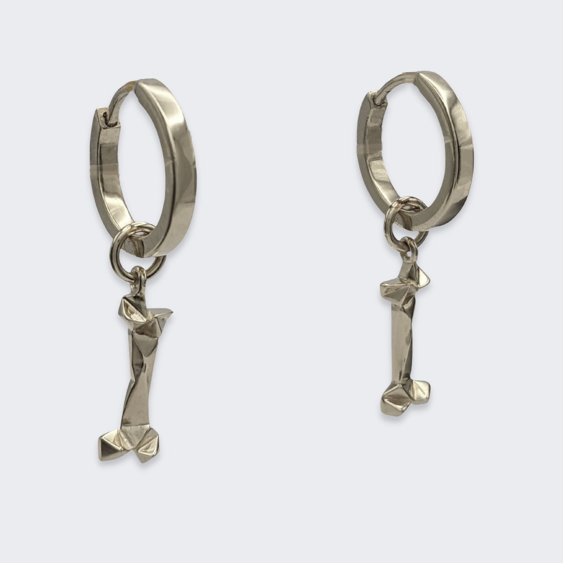 mars dog bone huggie hoop earrings in sterling silver pair (right side view)