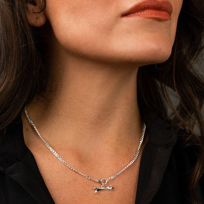 female model wearing the mars dog bone necklace in sterling silver